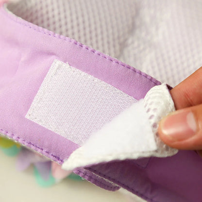 Close-up of the adjustable hook-and-loop closure on the dog harness.