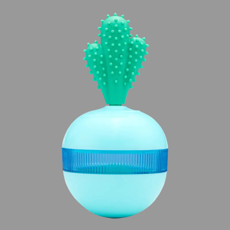 
Blue interactive dog treat dispenser ball with green textured dental cleaning top.