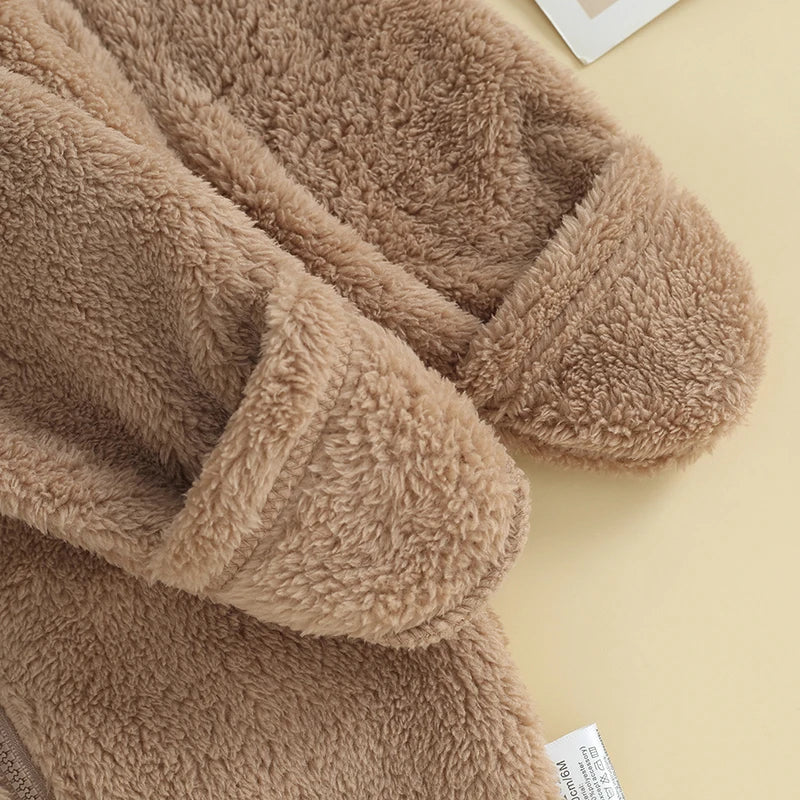 Close-up of sleeve cuff on brown fuzzy baby romper