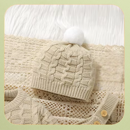 Cream cable knit baby pom-pom hat with ribbed trim