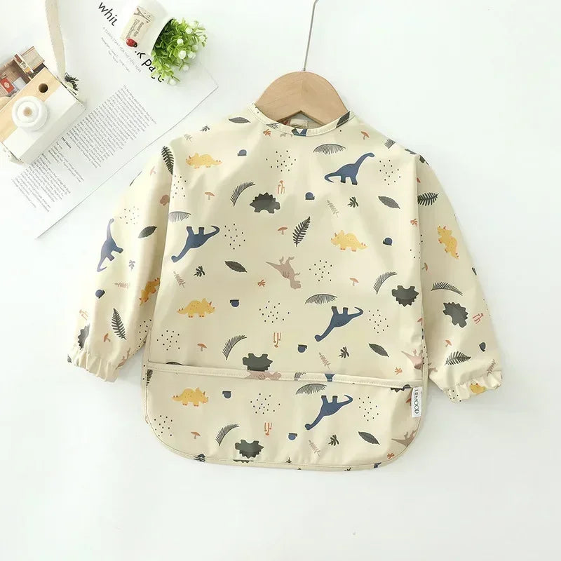 Dinosaur waterproof long sleeve baby bib with multicolor dinosaur print