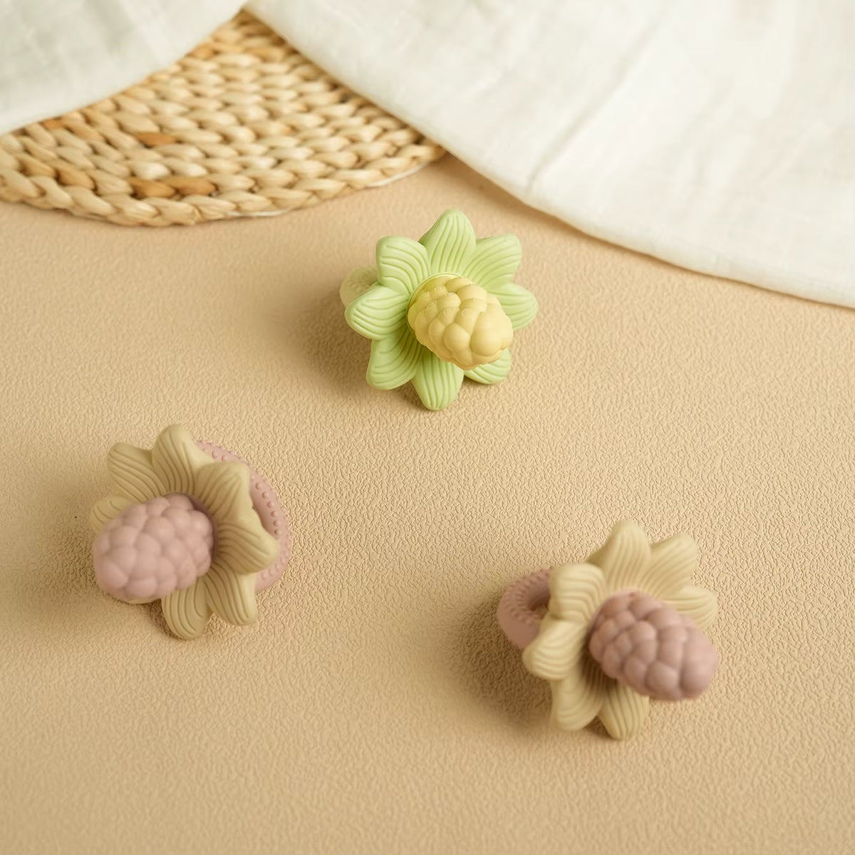 LuxeBloom silicone baby teethers in Beige Bloom, Sage Bloom and Lilac Bloom