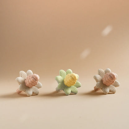 LuxeBloom silicone baby teethers in Beige Bloom, Sage Bloom and Lilac Bloom