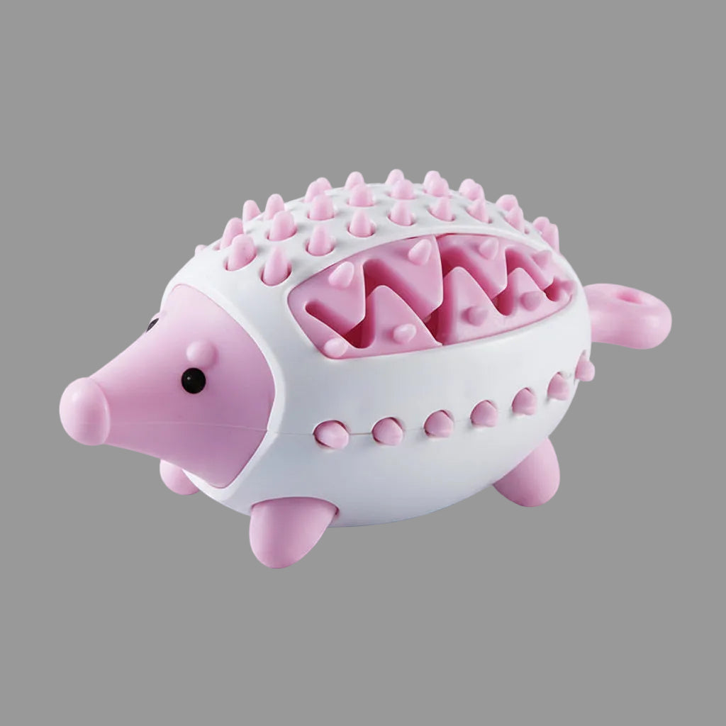 Pink interactive dog treat puzzle toy with textured chewing surface.