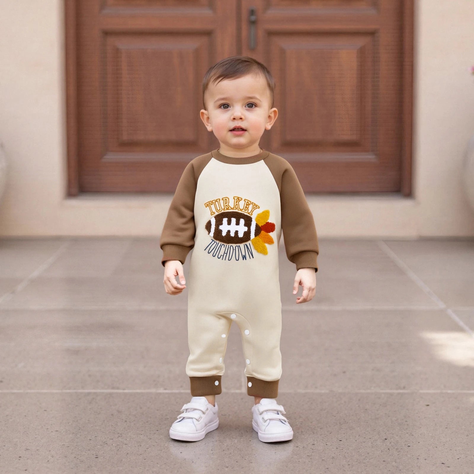 "Infant boy in festive Turkey Touchdown romper, luxury Thanksgiving and football babywear"