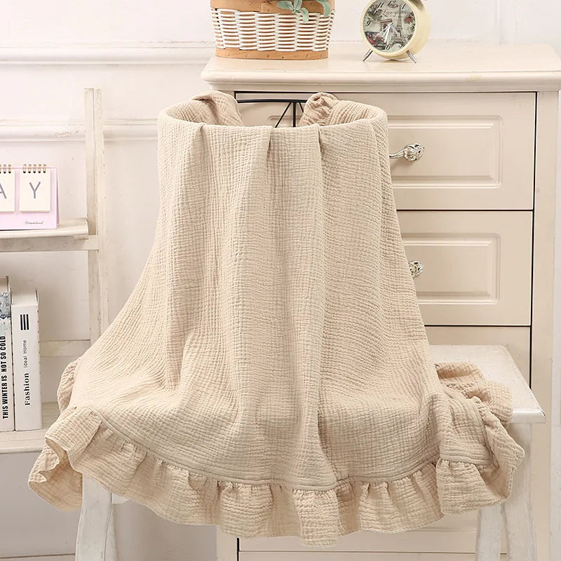 Organic muslin swaddle blanket in Sandstone – soft ruffled baby wrap for newborns