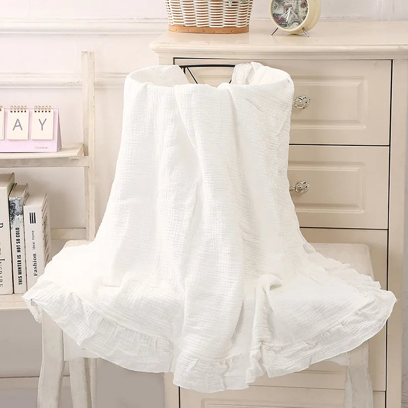 Organic muslin swaddle blanket in White – neutral ruffled baby wrap for newborns