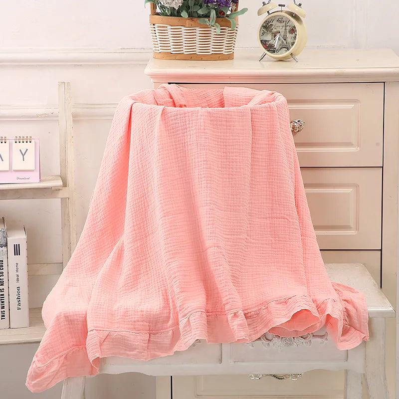 Organic muslin swaddle blanket in Pink – lightweight ruffled baby wrap for babies