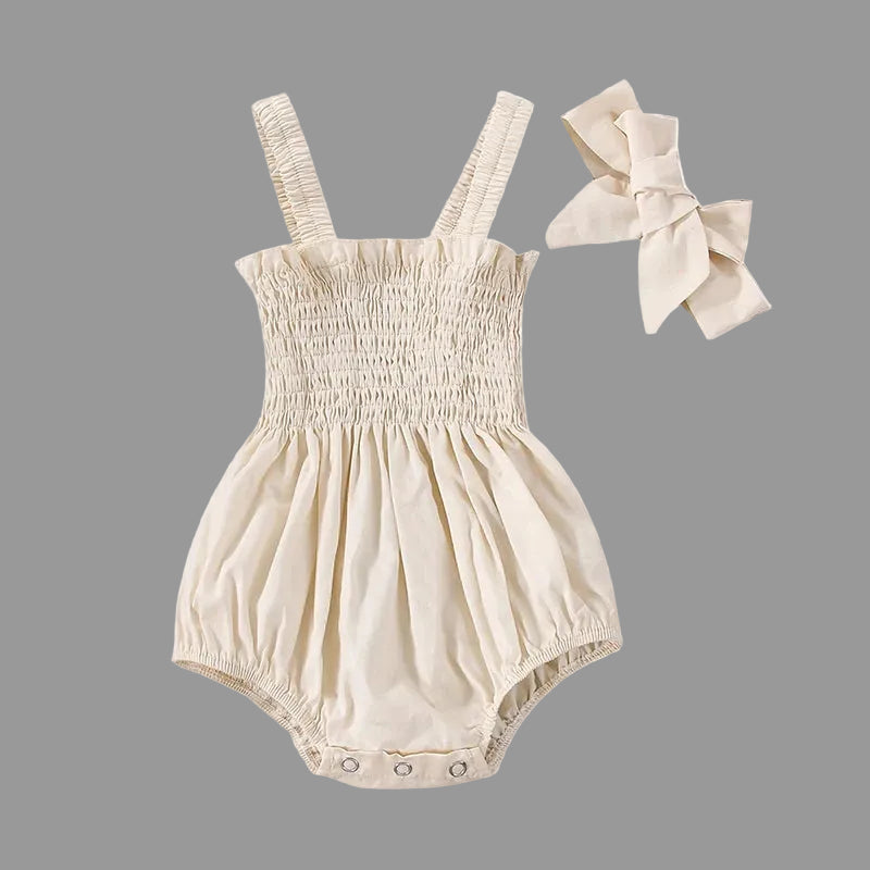 Soft Apricot smocked baby girl romper with matching bow headband