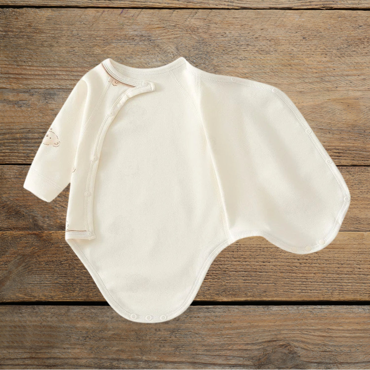 Tiny Bear cotton wrap baby romper showing side snap opening