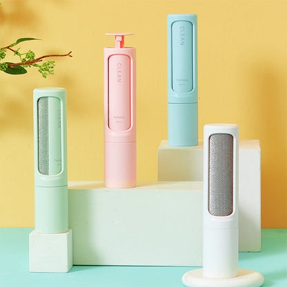 Reusable pet hair remover rollers in white, pink, blue, and green.