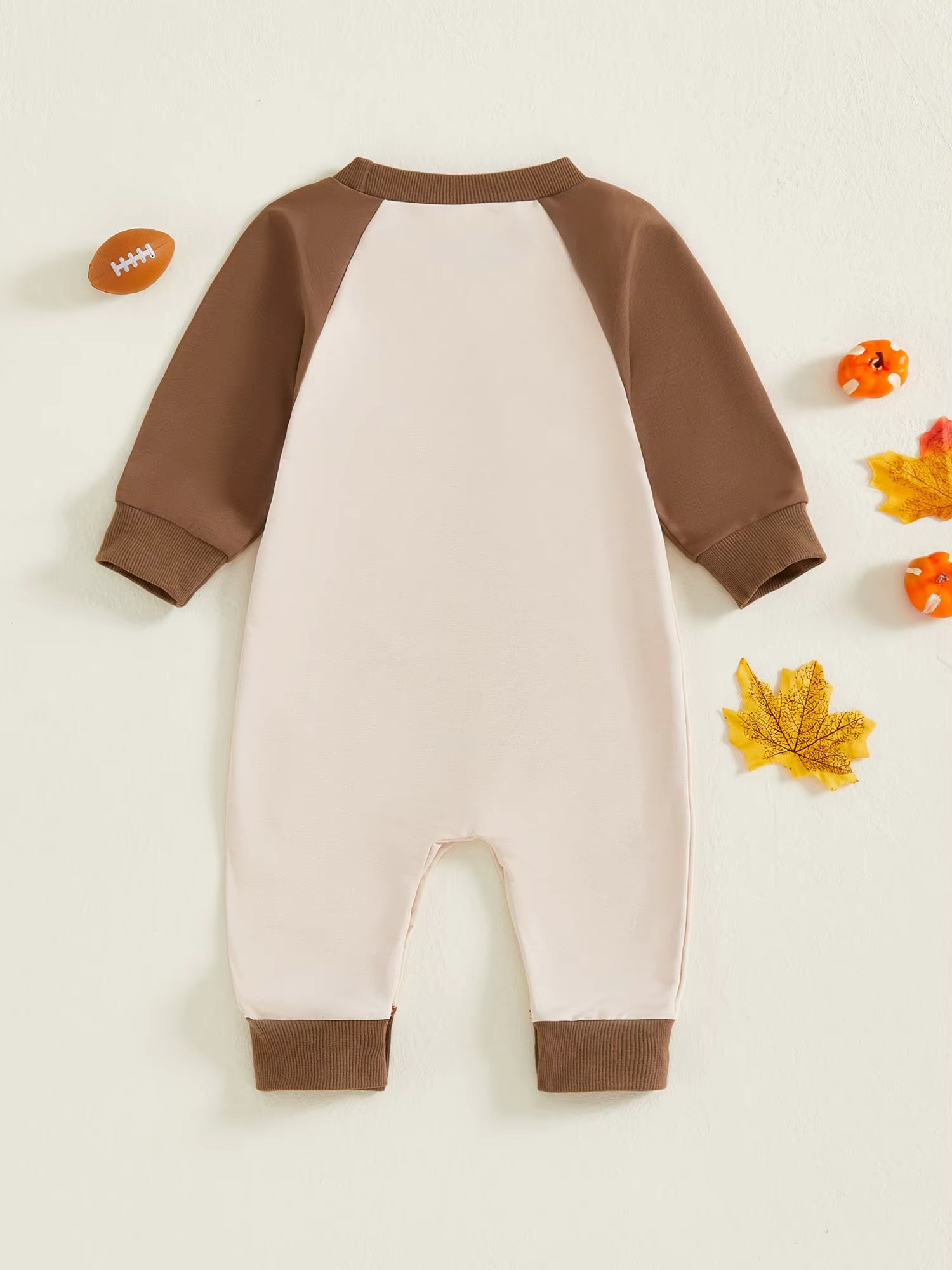 "Back view of long sleeve cotton romper in brown and cream, cozy fall baby outfit"