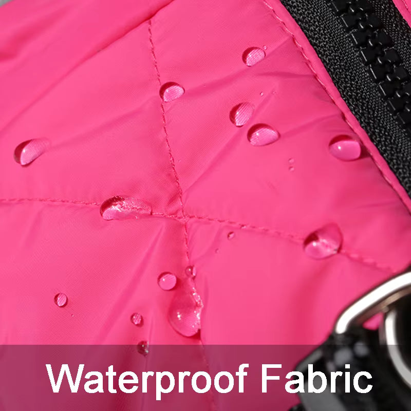 Close-up of waterproof fabric showing water droplets on pink jacket